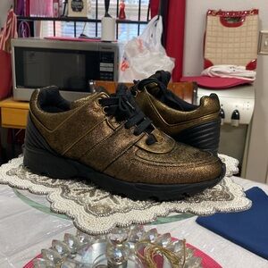NWOT Chanel 16K Low Top Sneakers Gold
Metallic Suede Size 39.5 EU